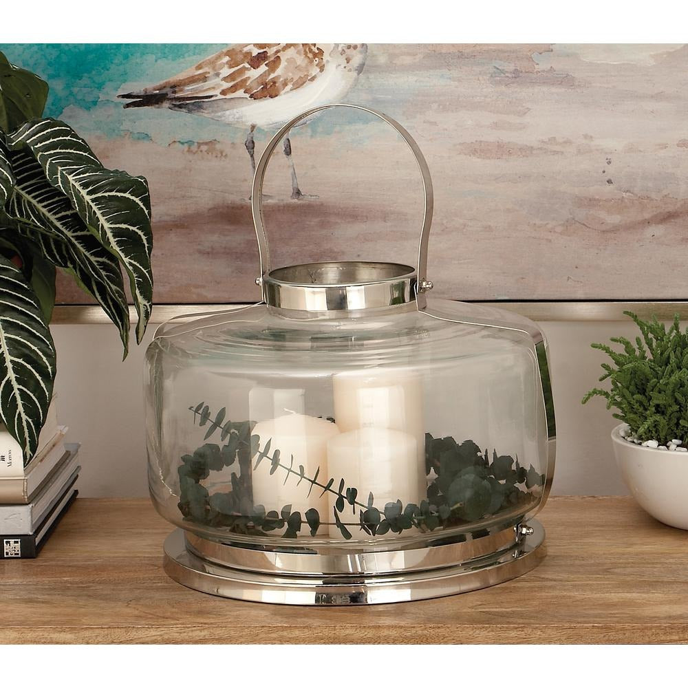 Farol de vela moderno de 14" de UMA Enterprises en acero inoxidable y vidrio con mango de alambre arqueado - Plateado