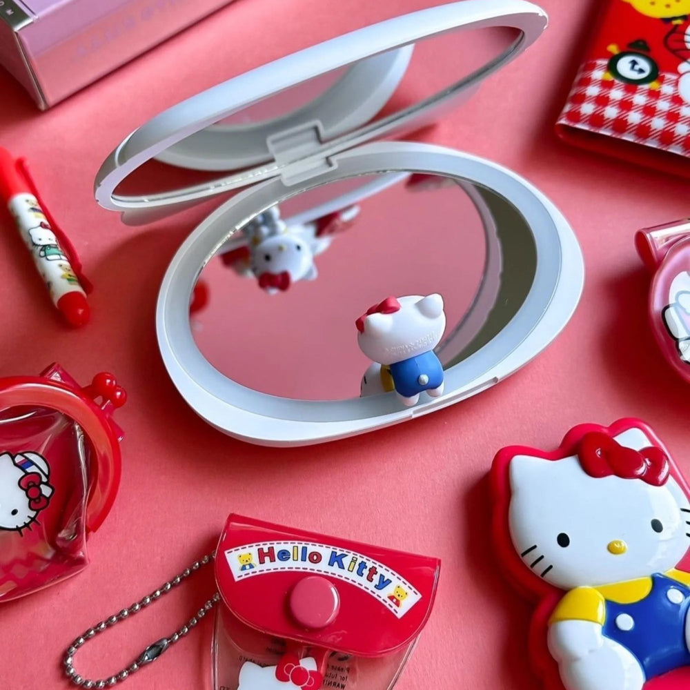 Espejo compacto inalámbrico con luz LED y sensor táctil de Hello Kitty de Impressions Vanity, color blanco