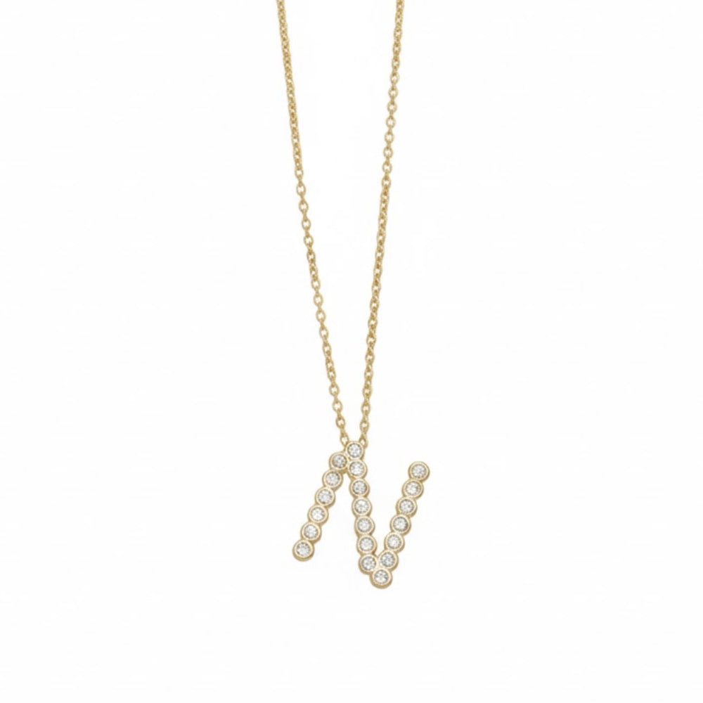 Collar con colgante de inicial "A" de cristal simple de 16,5" de Ettika en baño de oro de 18 k sobre latón y acero