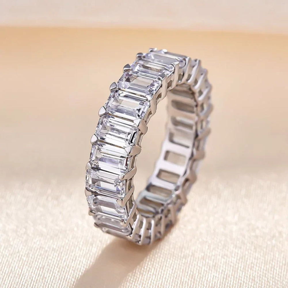 Anna Zuckerman Grace 55 Women's 5 ct. Diamond Crystalline Emerald Cut Eternity Ring in Platinum-Plating over 925 Sterling Silver
