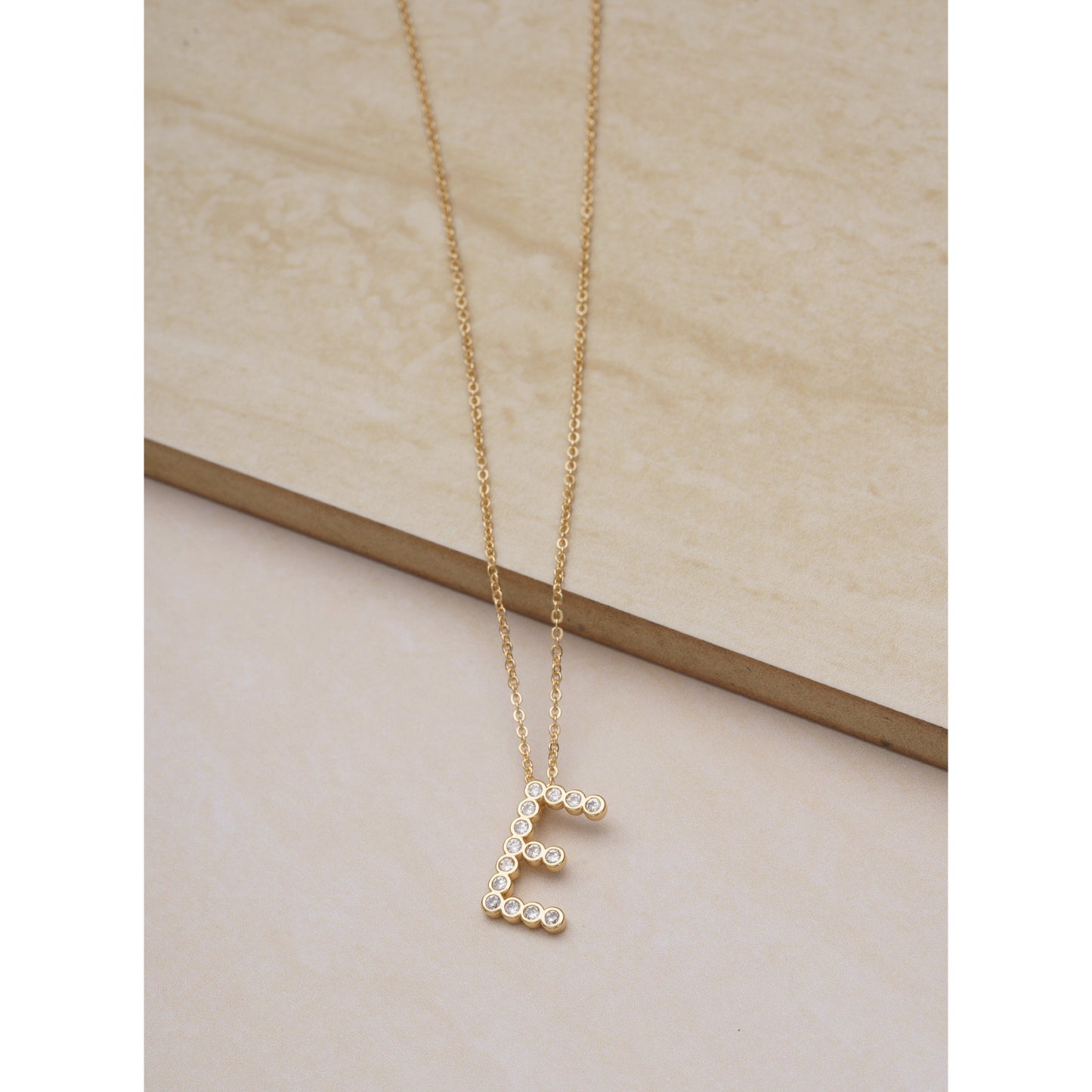 Ettika 16.5" Simple Crystal Initial "E" Pendant Necklace in 18k Gold Plate Over Brass and Steel