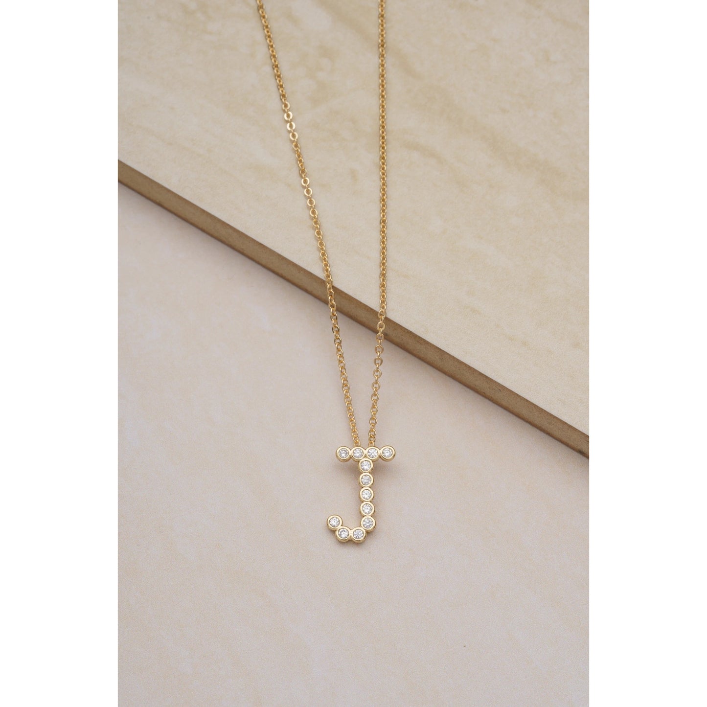 Ettika 16.5" Simple Crystal Initial "J" Pendant Necklace in 18k Gold Plate Over Brass and Steel