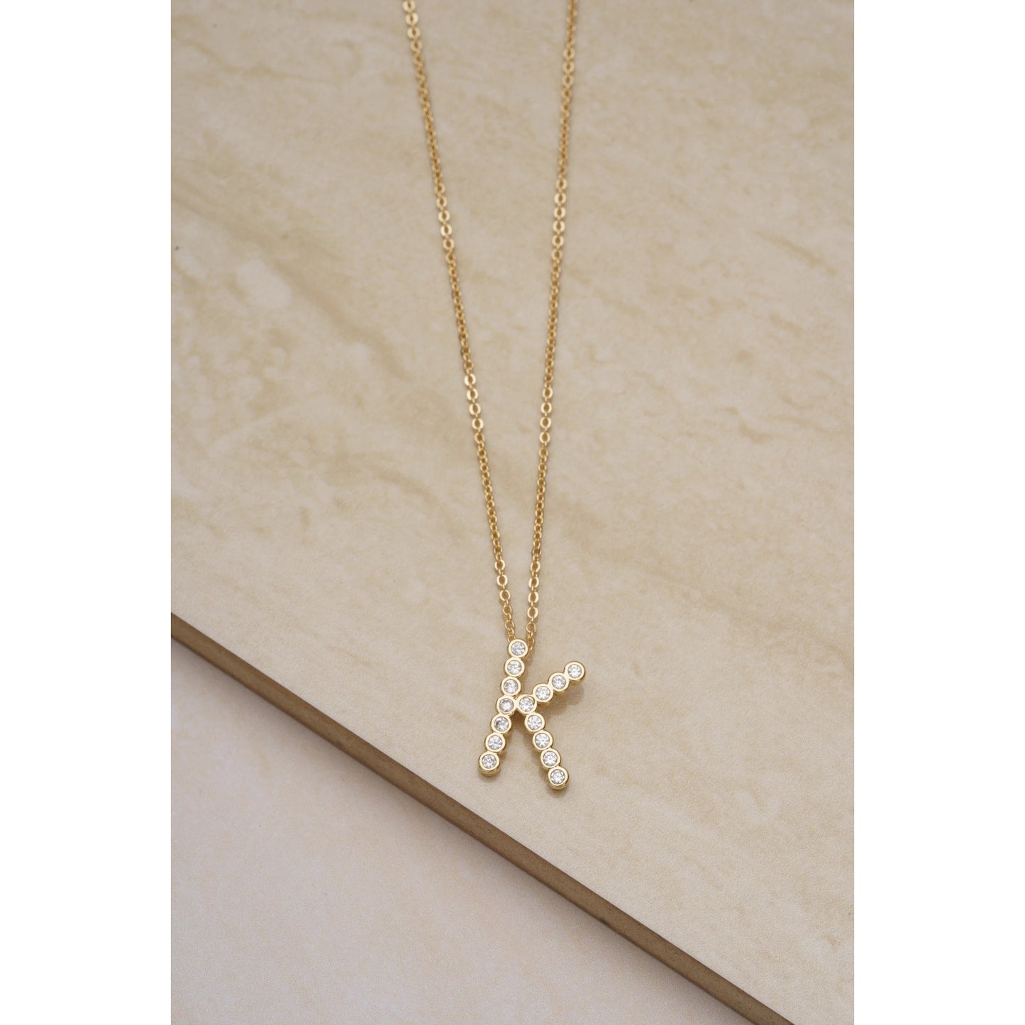 Ettika 16.5" Simple Crystal Initial "K" Pendant Necklace in 18k Gold Plate Over Brass and Steel