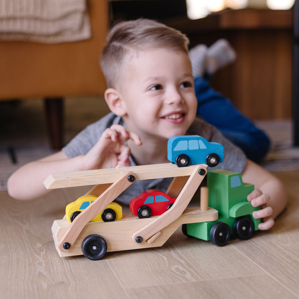 Melissa & Doug Wooden Car Carrier Playset with 1 Truck and 4 Cars