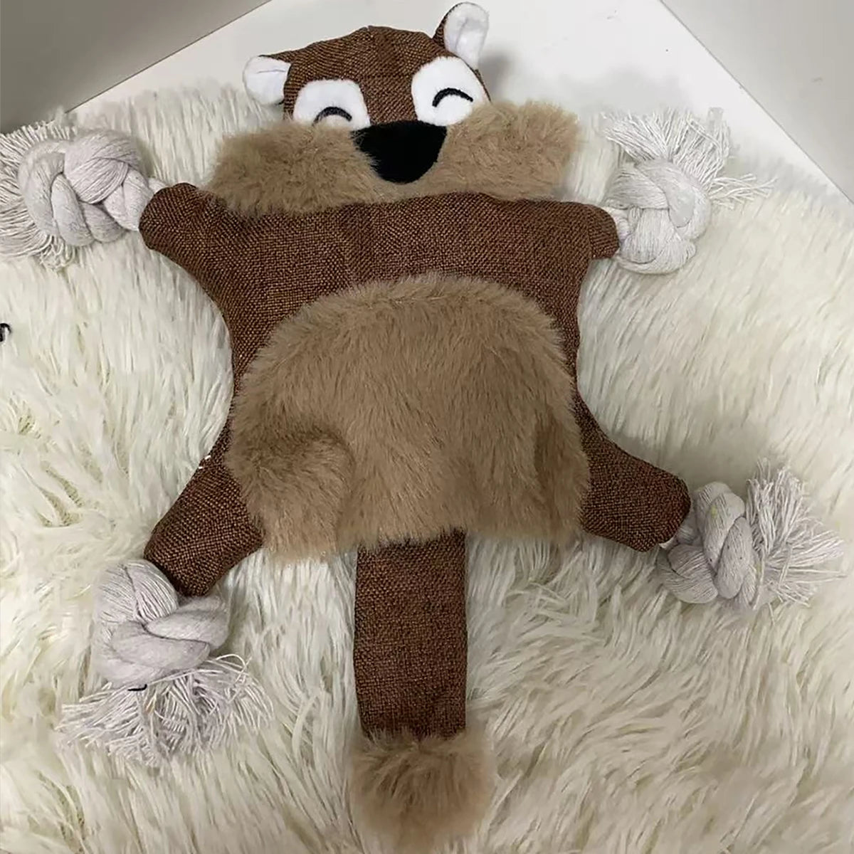 1 squeaky squirrel dog toy - tough chew and teething toy with squeaky sound and knots for aggressive chewers