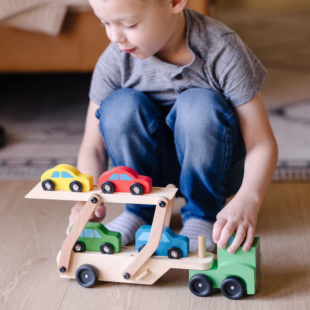 Melissa & Doug Wooden Car Carrier Playset with 1 Truck and 4 Cars